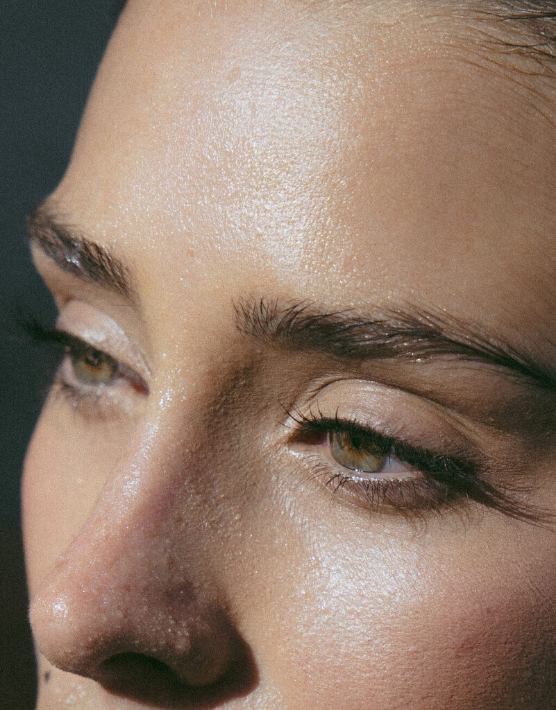 woman's eyebrows and lashes