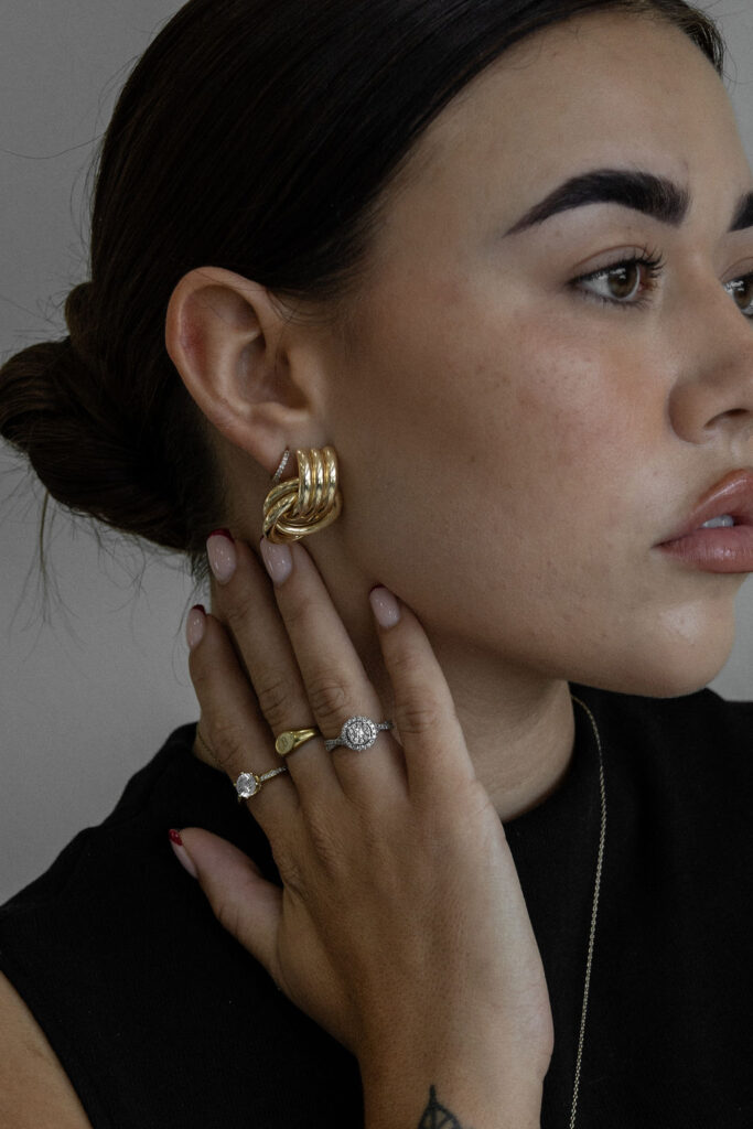 beautiful woman touching her neck